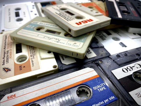 a pile of assorted cassettes
