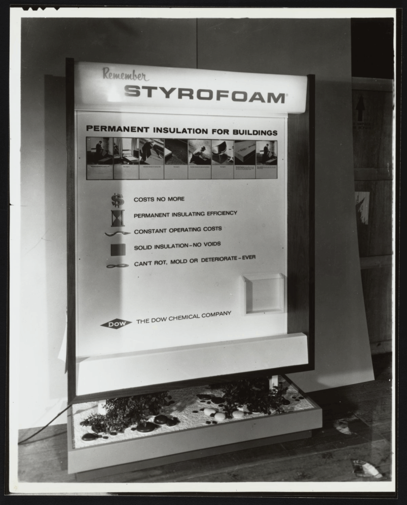 A black and white photo from the Dow Chemical Company, display for Styrofoam insulation for buildings.
